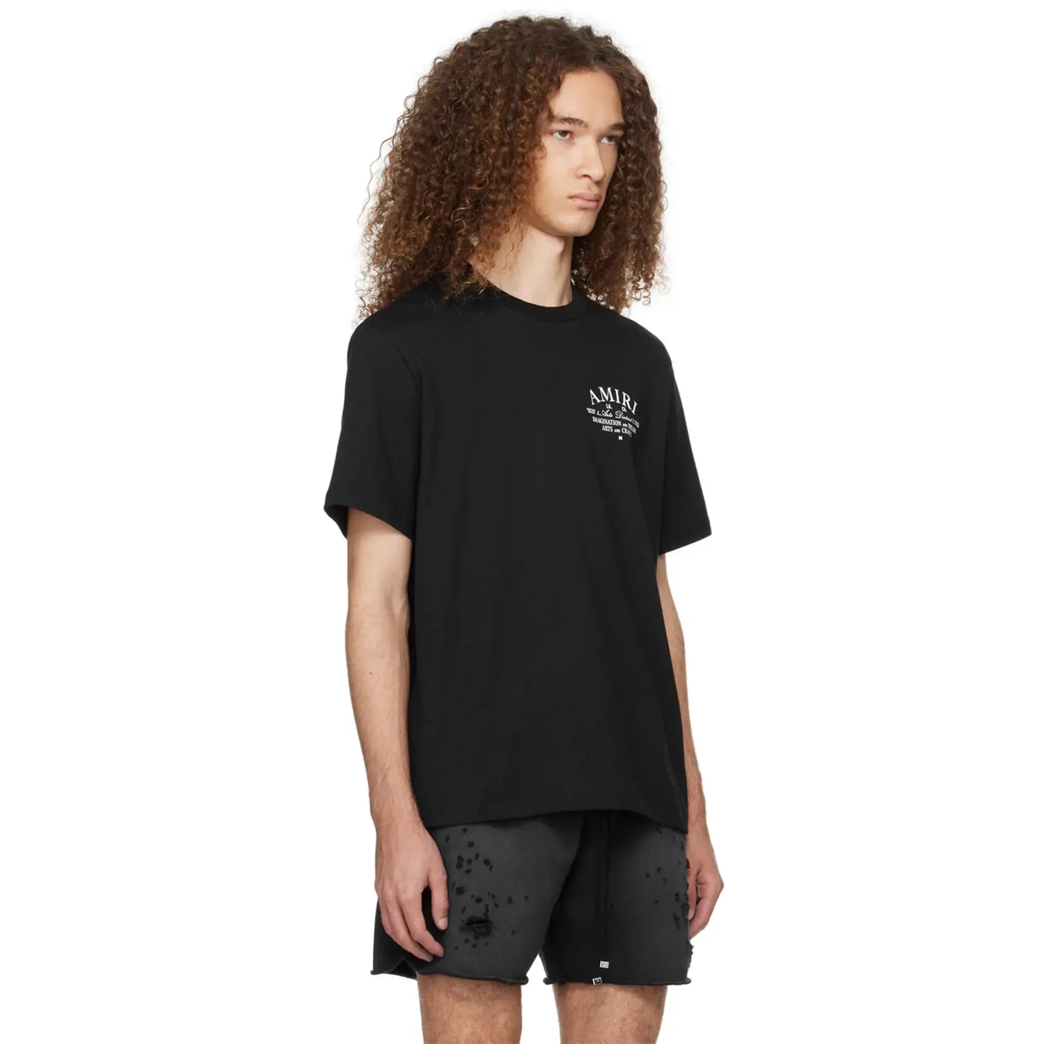 Model side view of Amiri Arts District Black T Shirt PXMJT001-001